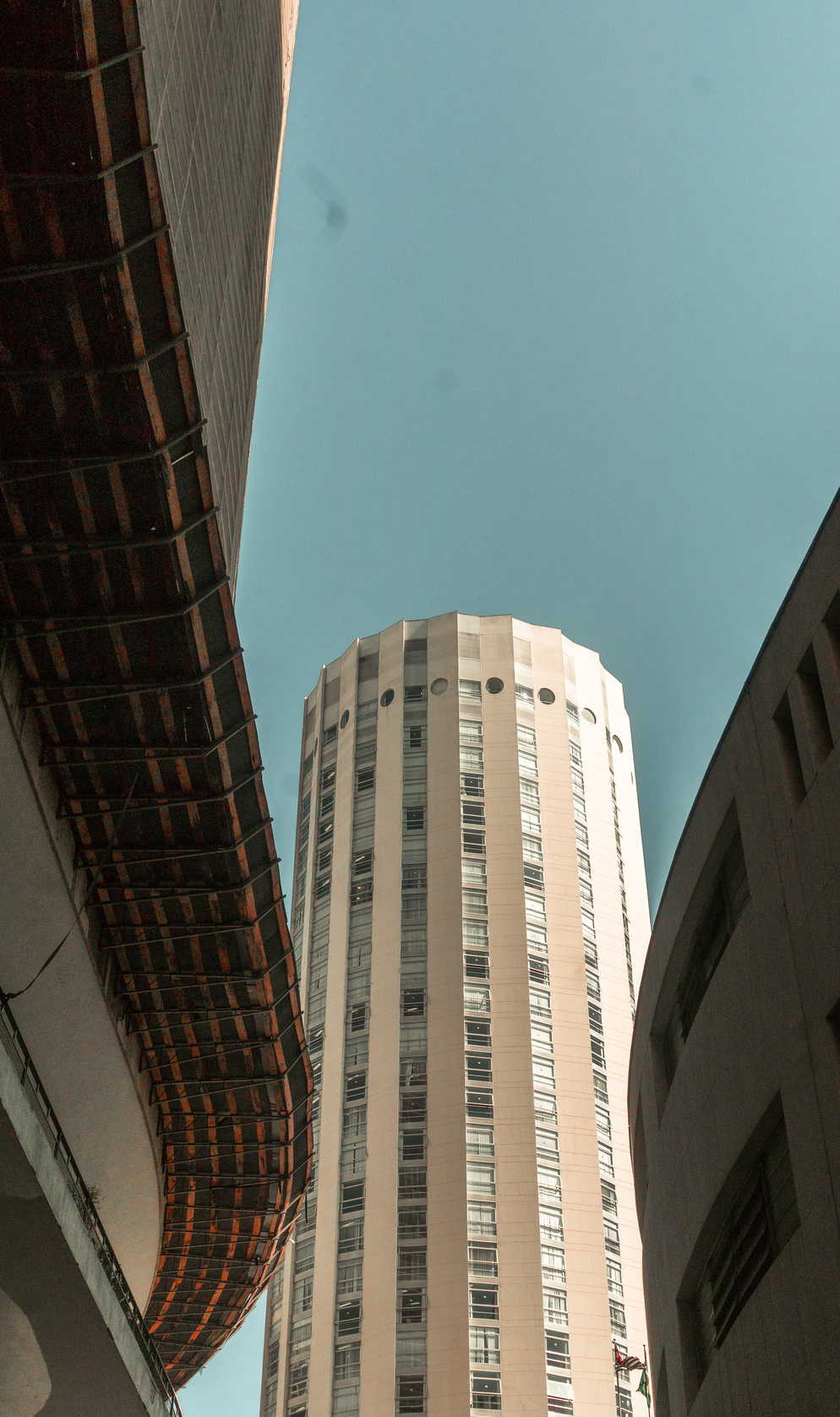 Cylindrical High-rise Building Under Clear Blue Sky